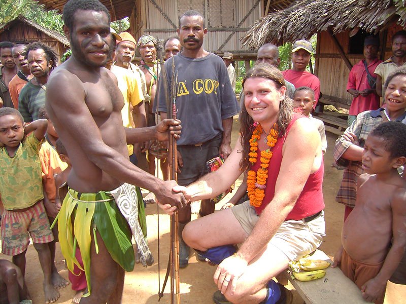 Jim Thomas with villagers